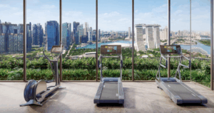 Luxury gym overlooking Marina Bay skyline at One Marina Gardens, a leading example of Singapore's green condos blending city living with nature