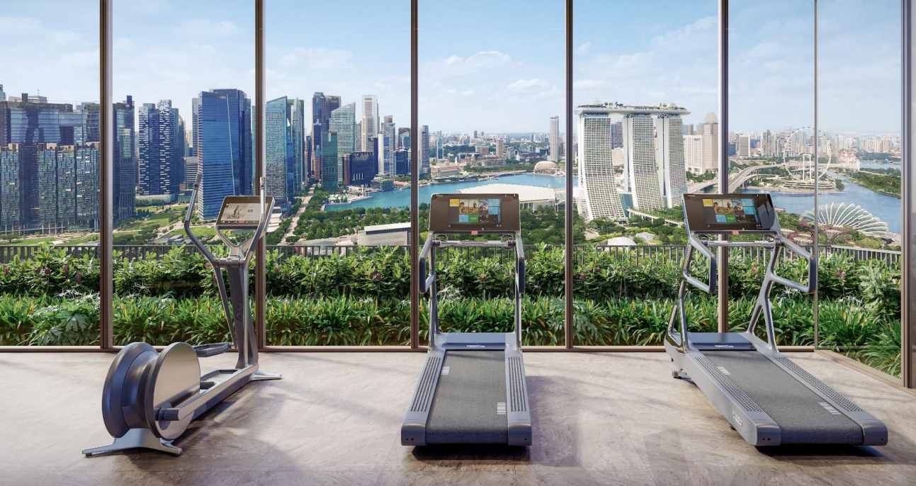 Luxury gym overlooking Marina Bay skyline at One Marina Gardens, a leading example of Singapore's green condos blending city living with nature
